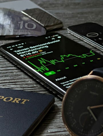a-passport--cell-phone--watch-and-wallet-on-a-table.jpg a passport, cell phone, watch and wallet on a table