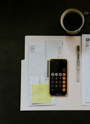 black-android-smartphone-near-ballpoint-pen--tax-withholding-certificate-on-top-of-white-folder.jpg black Android smartphone near ballpoint pen, tax withholding certificate on top of white folder